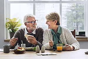a happy elderly couple that just purchased a life insurance plan
