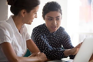 a life insurance consultant discussing mortgage payment options with a client