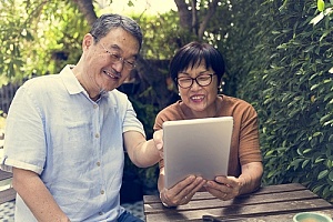 an elderly couple reviewing their life insurance plan to ensure protection of their estate