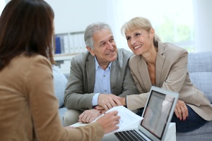 couple visiting a life insurance consultant
