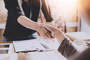 handshake between a life insurance consultant and a client