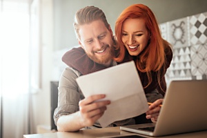 happy couple looking over their iul policy