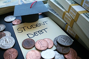 money and a graduation cap representing student loans