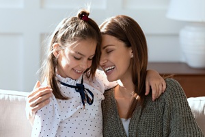 mother and daughter smiling