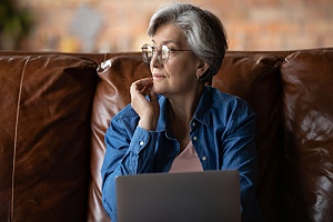 retired woman thinking about her retirement plan