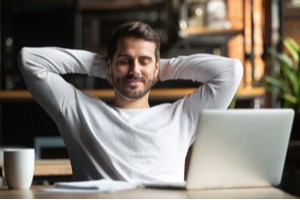 Man feeling relaxed after finishing work
