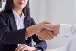 insurance agent shaking hand with customer