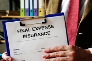 man holding file with final expense insurance documents