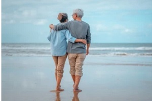 couple enjoying in beach after retirement