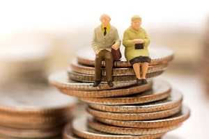 old couple on coin stack