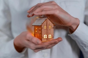 women holding home dummy in hand